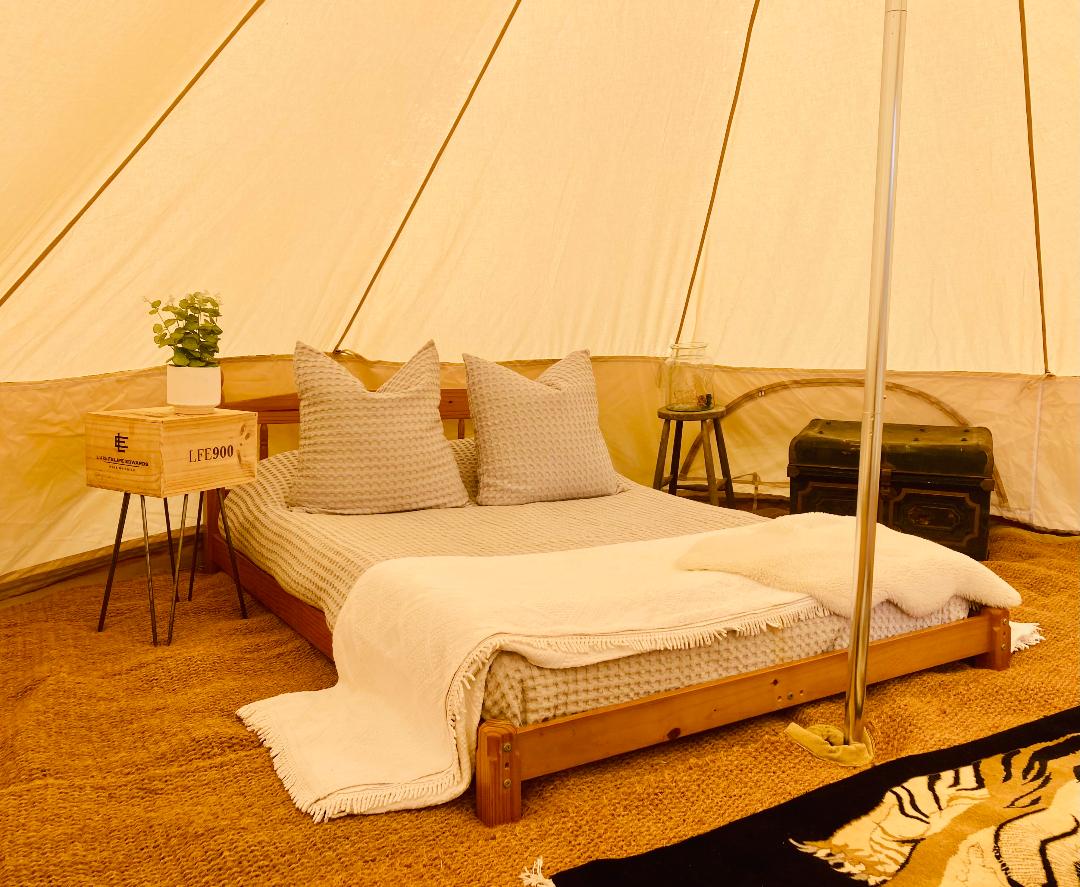 Inside a furnished bell tent